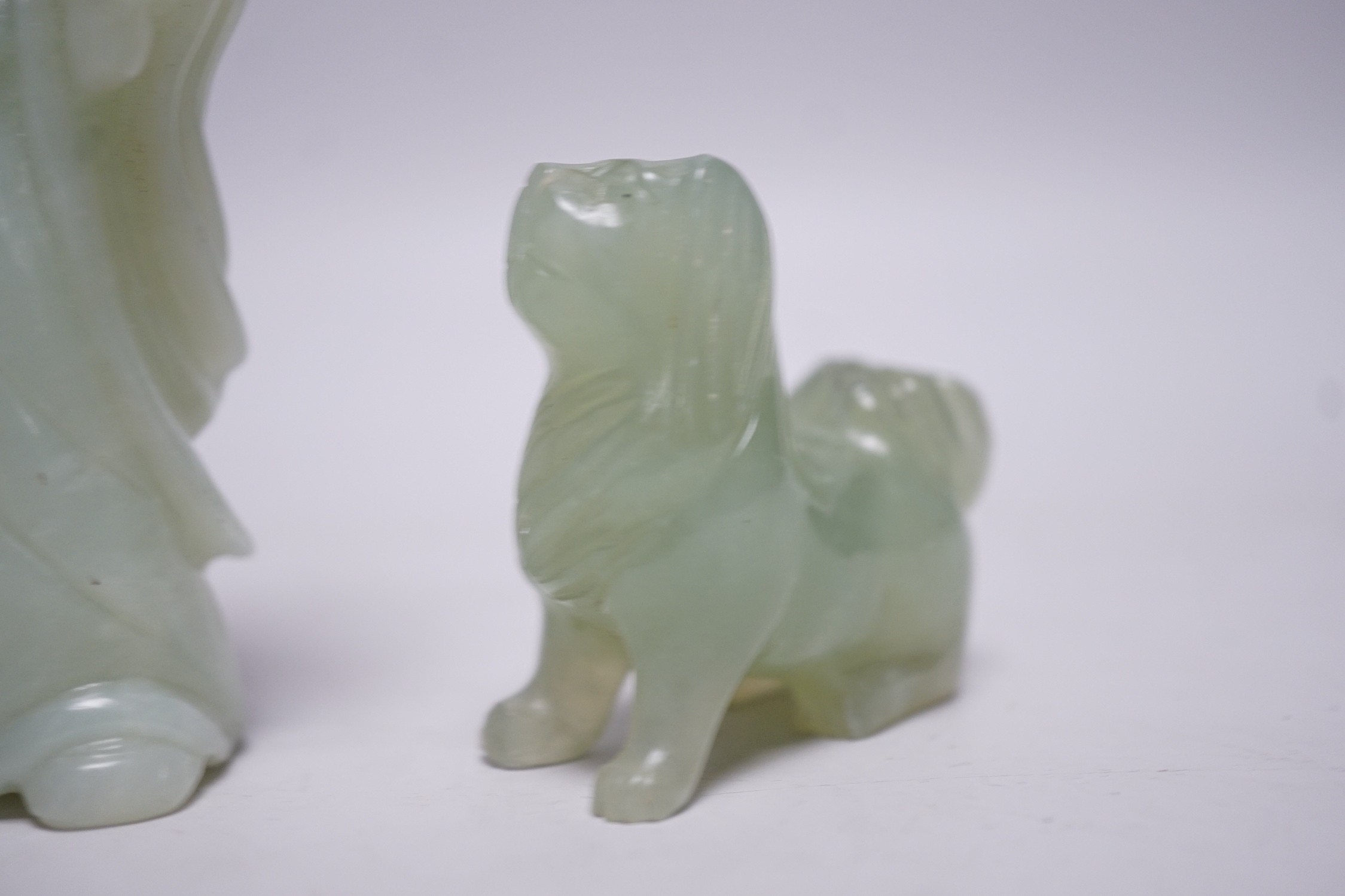 Three Chinese bowenite jade carvings of a Bactrian camel, a Pekinese dog and Shou Lao, tallest 12cm
